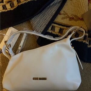 NWT Steve Madden bone /ivory purse made of polyurethane